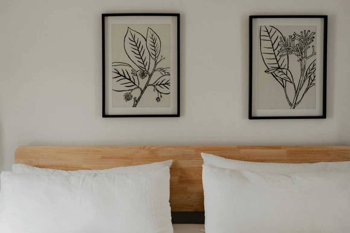 The framed prints give this bedroom a calm aesthetic.