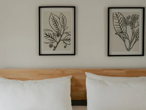 The framed prints give this bedroom a calm aesthetic.
