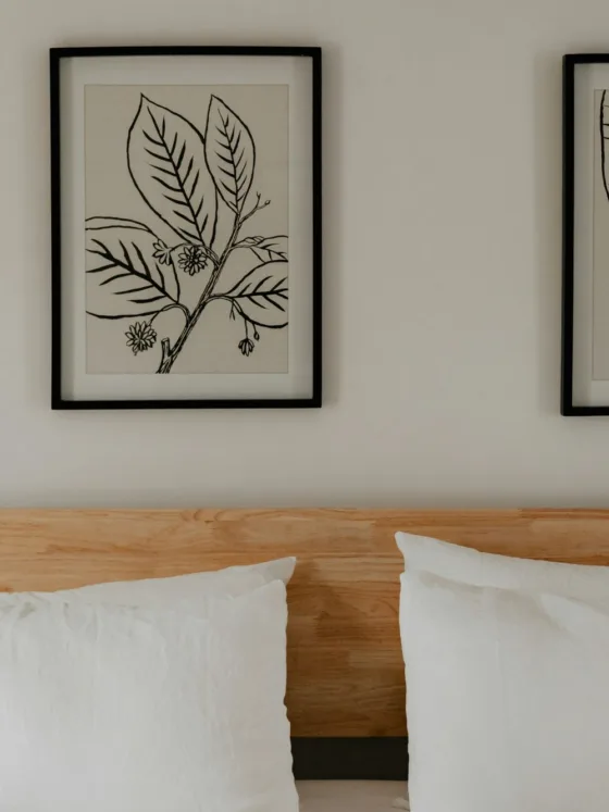 The framed prints give this bedroom a calm aesthetic.