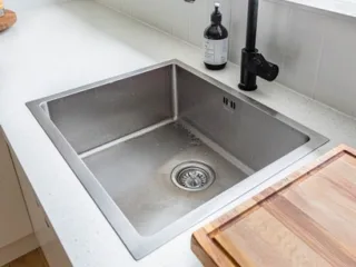 featured image - The Ultimate Guide to Unclogging Your Kitchen Sink
