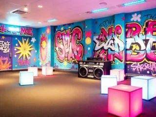 Make your retro party epic! Use cool posters & funky lights for a throwback vibe.